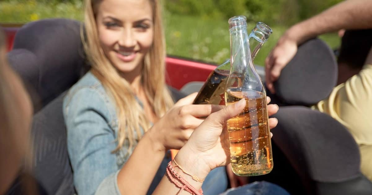 a woman holding a glass of wine