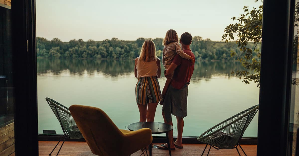 a person standing in front of a body of water
